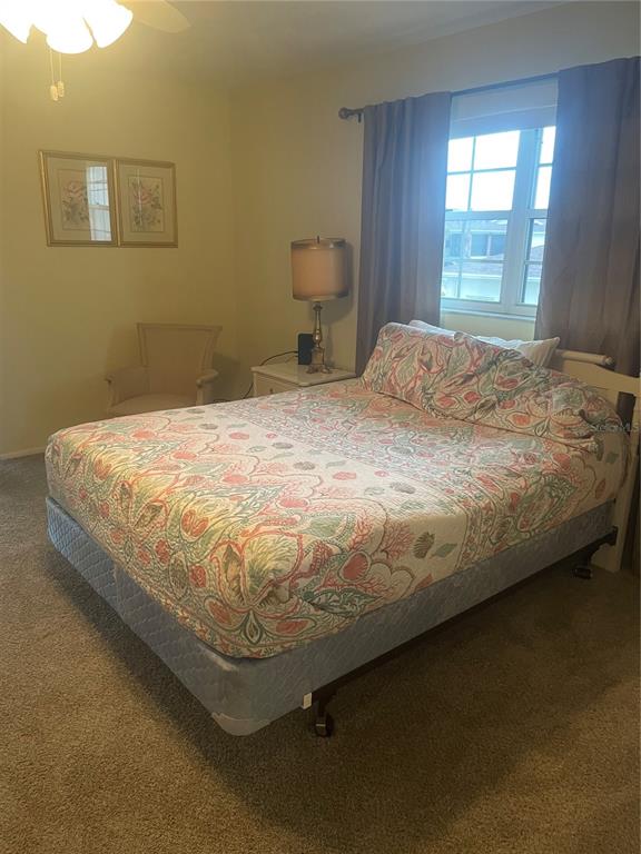 1531 Placida Road, Unit 201 Englewood, FL 34223 - Photo 17 of 25 a bed sitting in a bedroom next to a window