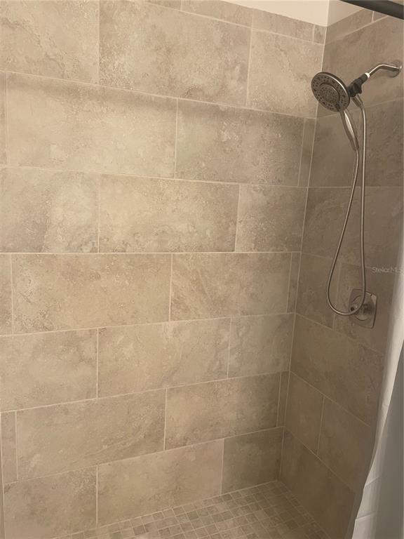 1531 Placida Road, Unit 201 Englewood, FL 34223 - Photo 18 of 25 a bathroom with a shower