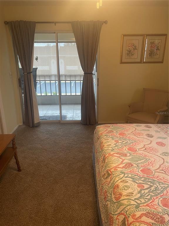 1531 Placida Road, Unit 201 Englewood, FL 34223 - Photo 21 of 25 a bedroom with a bed and window