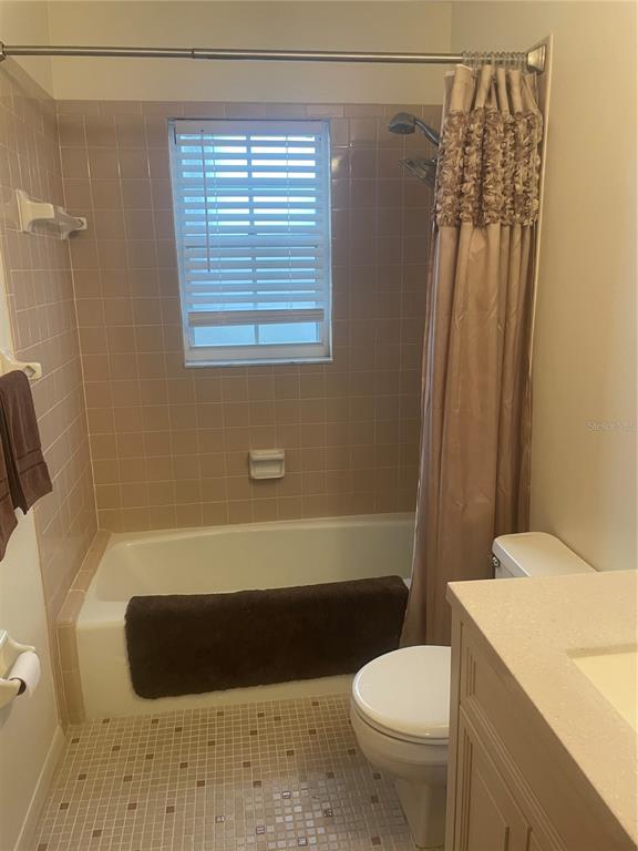 1531 Placida Road, Unit 201 Englewood, FL 34223 - Photo 22 of 25 a bathroom with a toilet and a shower