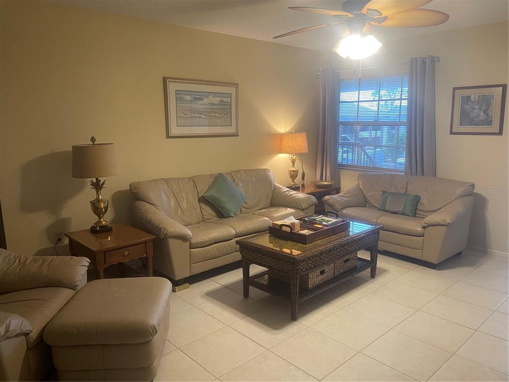 1531 Placida Road, Unit 201 Englewood, FL 34223 - Photo 9 of 25 a living room with furniture and a window