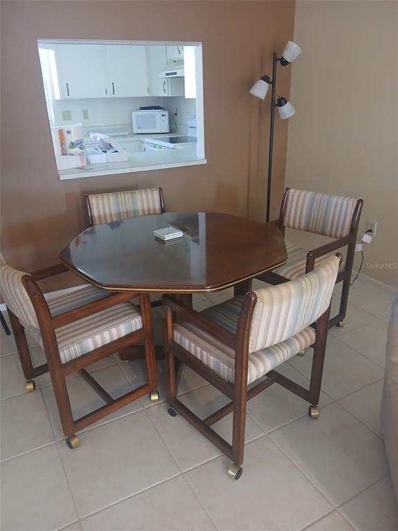 1531 Placida Road, Unit 201 Englewood, FL 34223 - Photo 10 of 25 a view of a room that has a couch and a table in it