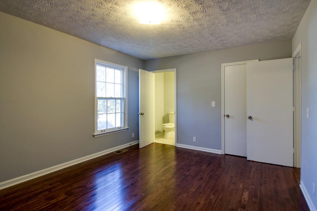 3280 Anderson Road Antioch, TN 37013 - Photo 12 of 30 an empty room with wooden floor and windows