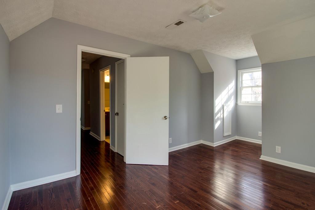 3280 Anderson Road Antioch, TN 37013 - Photo 16 of 30 an empty room with wooden floor and windows