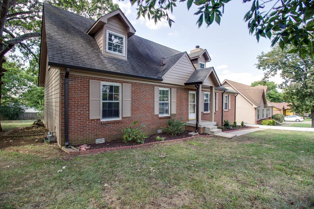 3280 Anderson Road Antioch, TN 37013 - Photo 2 of 30 a front view of a house with a yard and garage