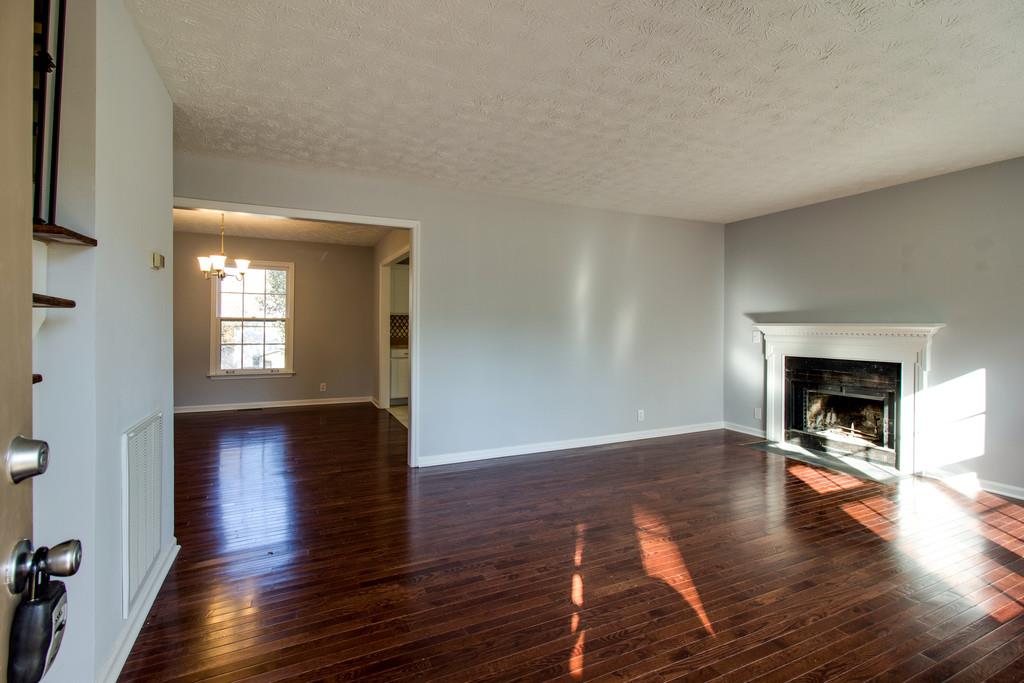 3280 Anderson Road Antioch, TN 37013 - Photo 4 of 30 a view of empty room with wooden floor and fireplace