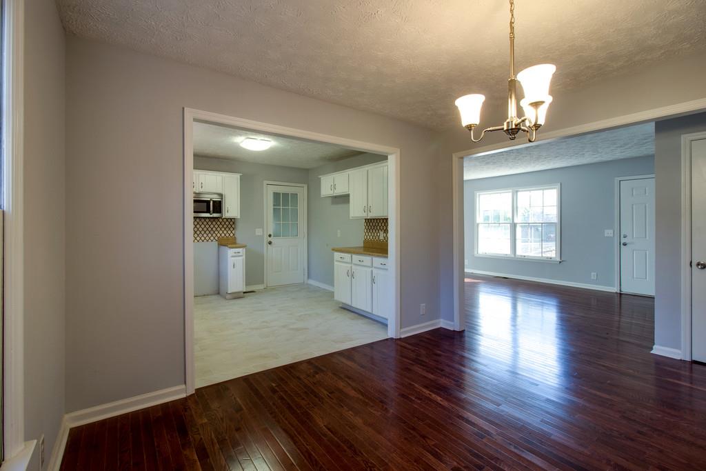 3280 Anderson Road Antioch, TN 37013 - Photo 7 of 30 a view of livingroom with hardwood floor and a kitchen