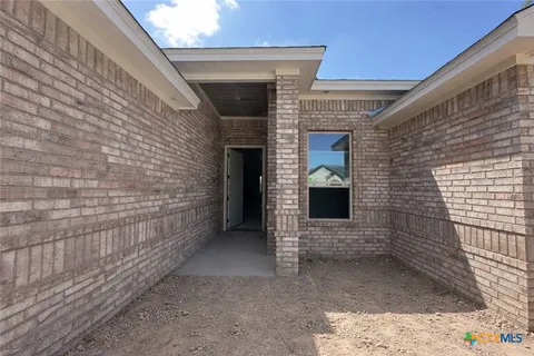 a view of front door of a house with a door