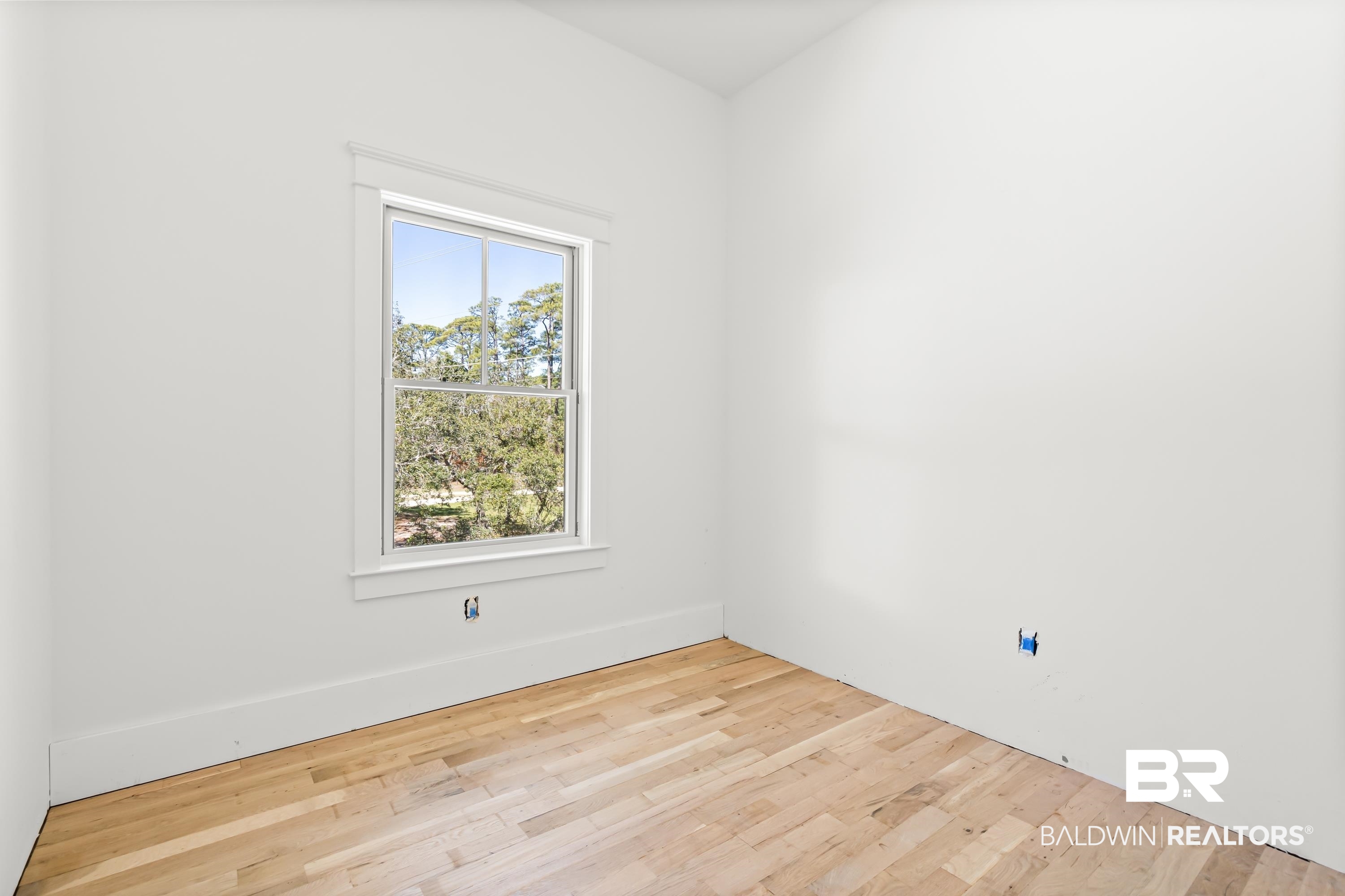 14686 State Highway Gulf Shores, AL 36542 - Photo 19 of 44 Unfurnished room featuring baseboards and wood finished floors
