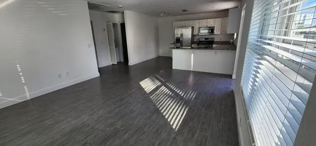 a kitchen with sink and refrigerator