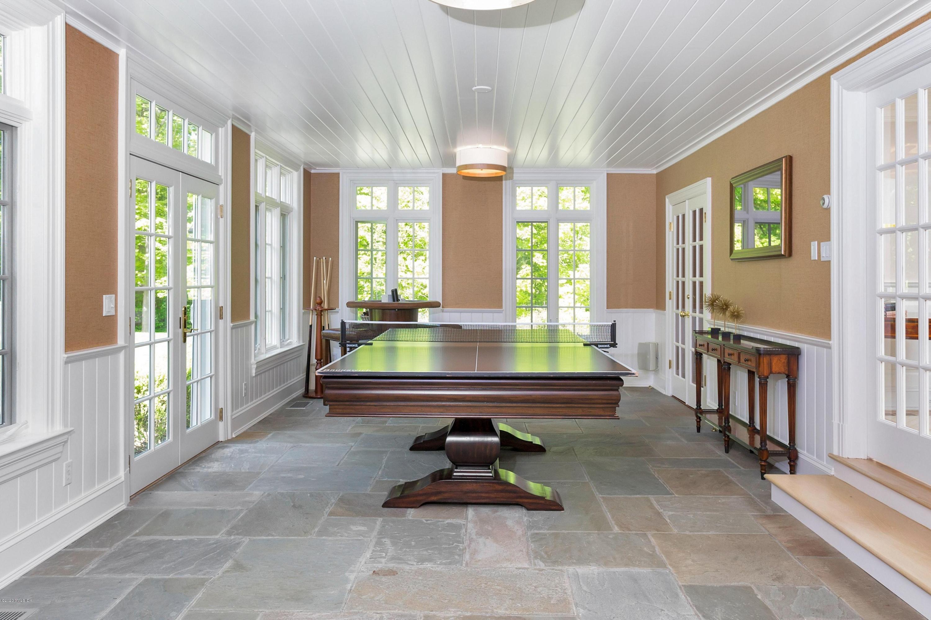 122 Butternut Hollow Road Greenwich, CT 06830 - Photo 13 of 36 a living room with furniture and large windows
