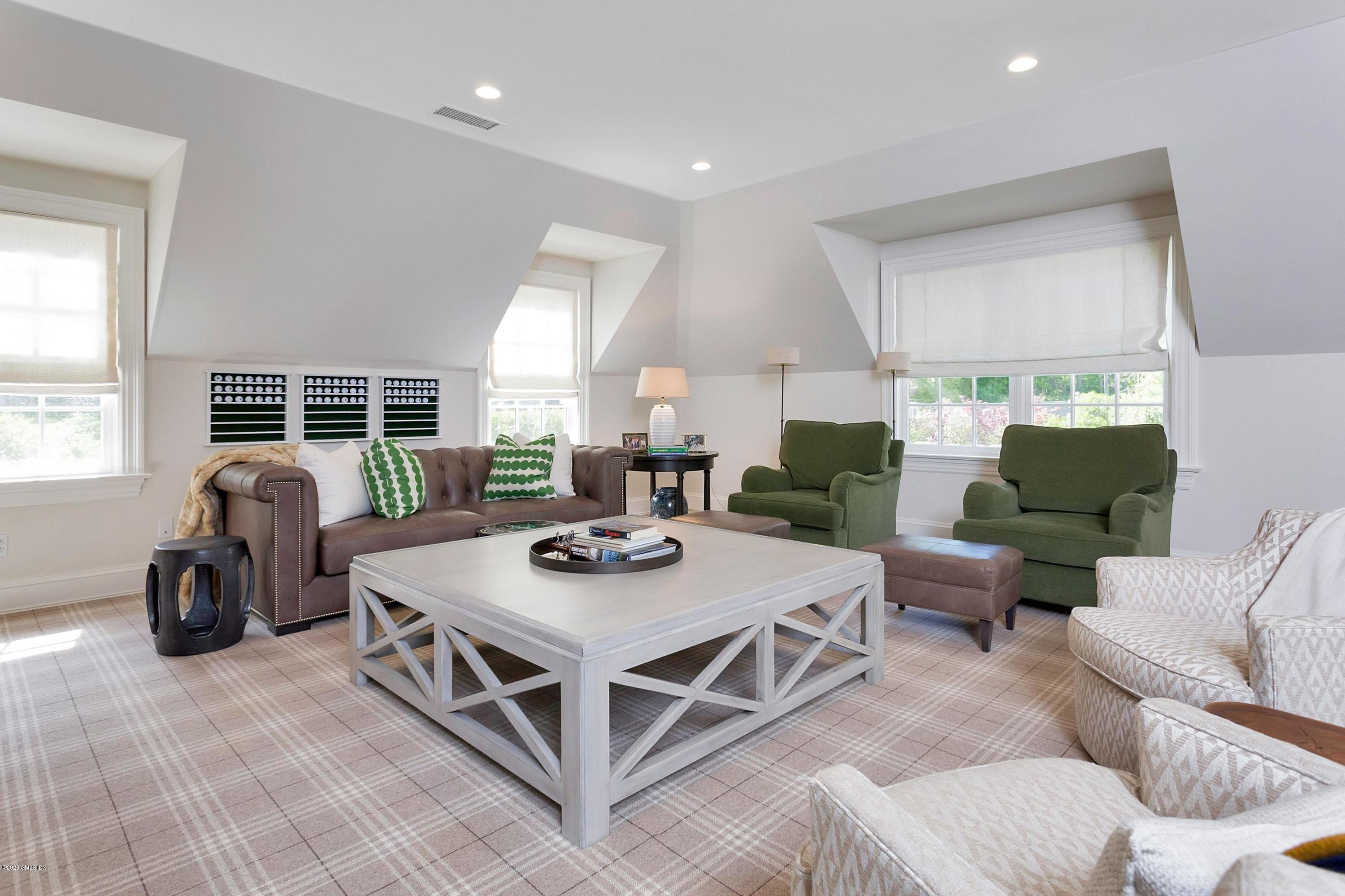 122 Butternut Hollow Road Greenwich, CT 06830 - Photo 17 of 36 a living room with furniture and windows