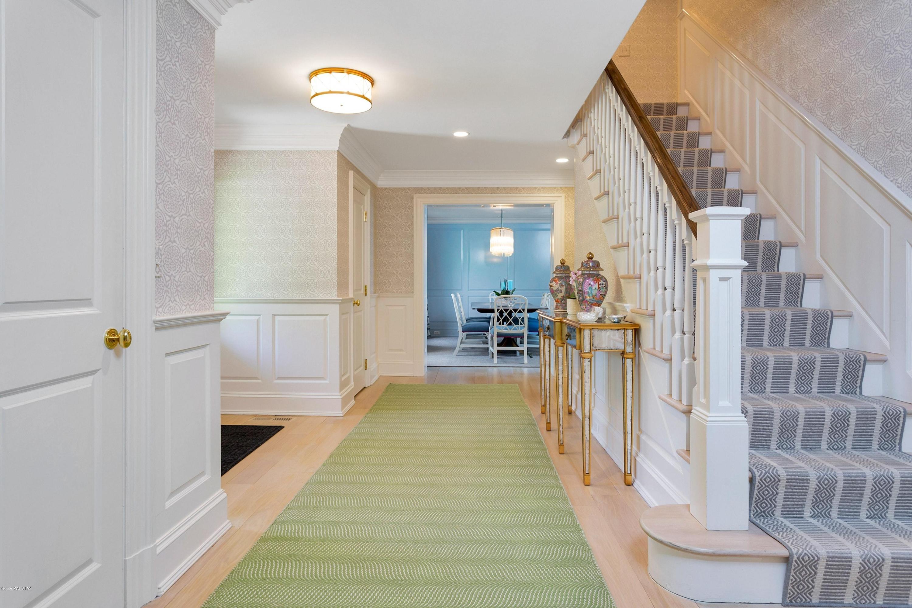 122 Butternut Hollow Road Greenwich, CT 06830 - Photo 20 of 36 a view of a hallway with wooden floor and staircase