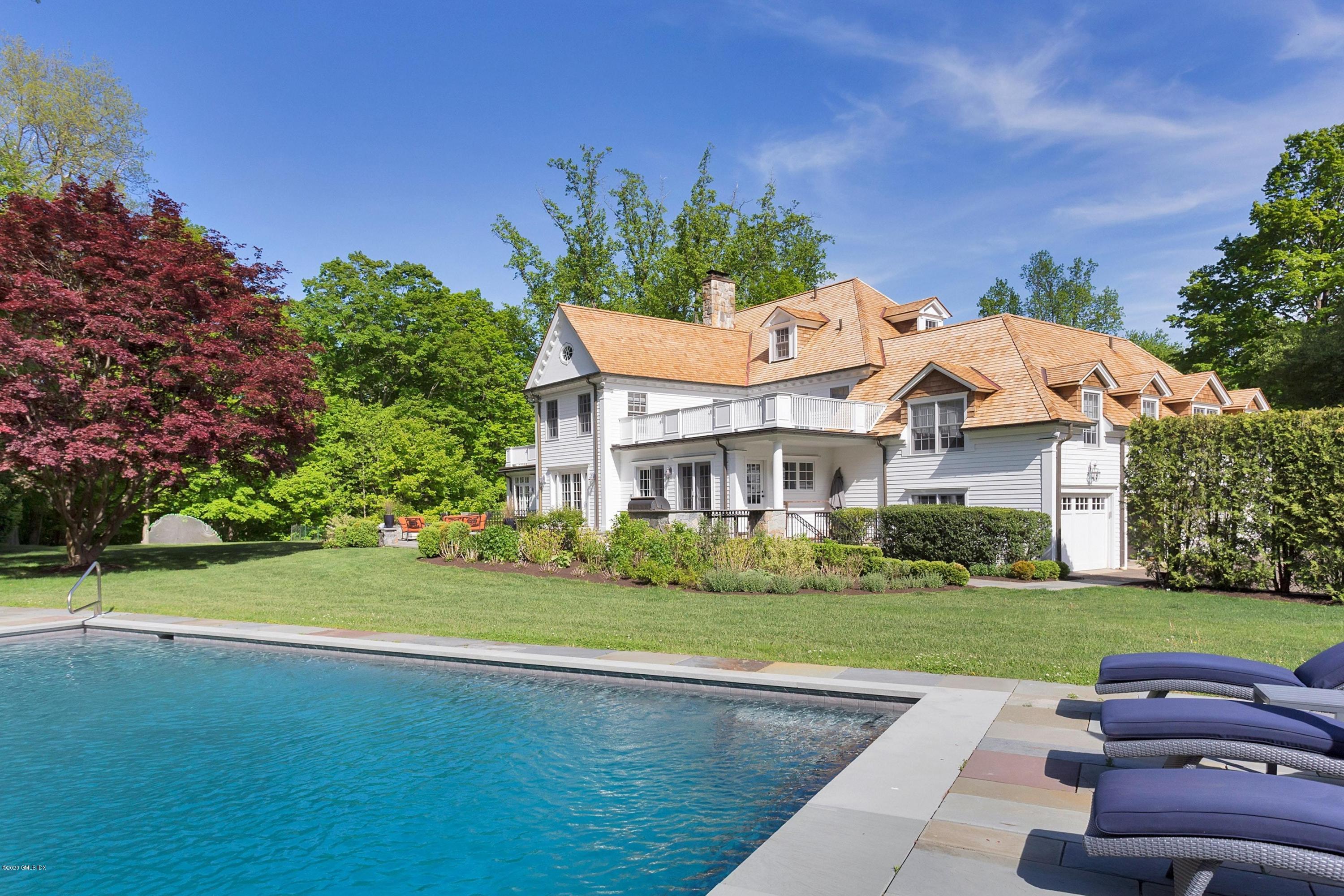 122 Butternut Hollow Road Greenwich, CT 06830 - Photo 2 of 36 a front view of a house with garden