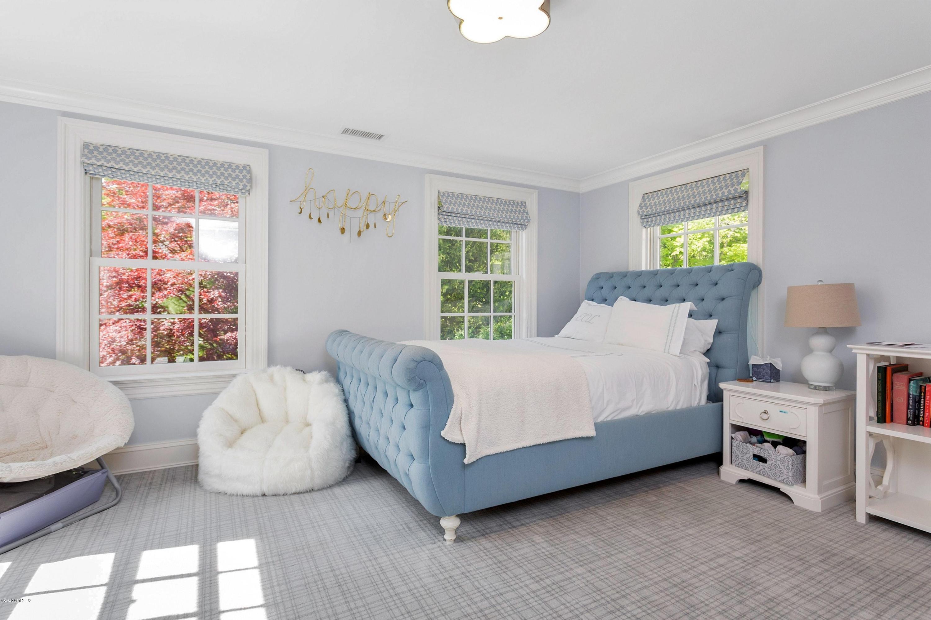 122 Butternut Hollow Road Greenwich, CT 06830 - Photo 27 of 36 a bedroom with a bed and a couch
