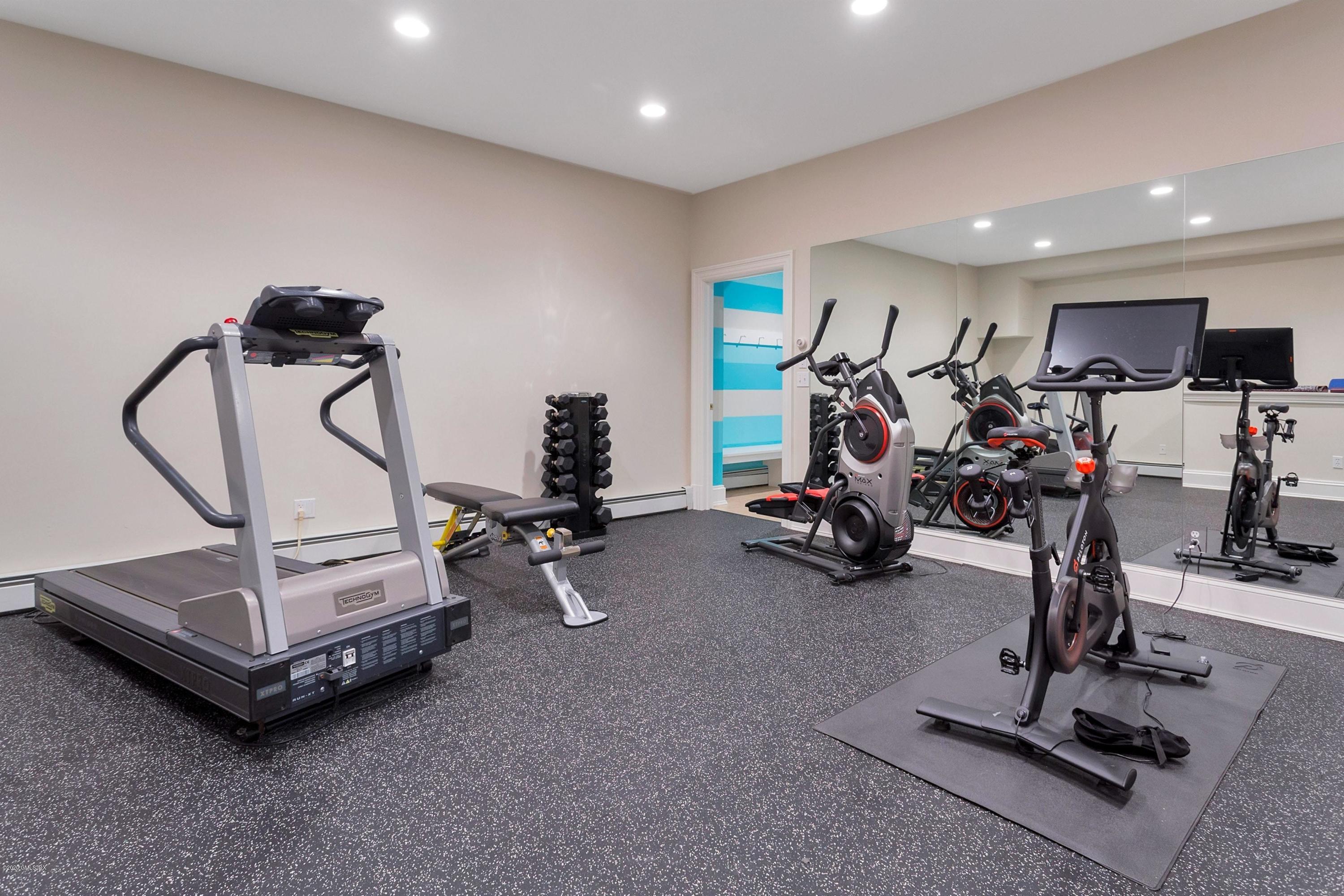 122 Butternut Hollow Road Greenwich, CT 06830 - Photo 29 of 36 a view of a room with gym equipment