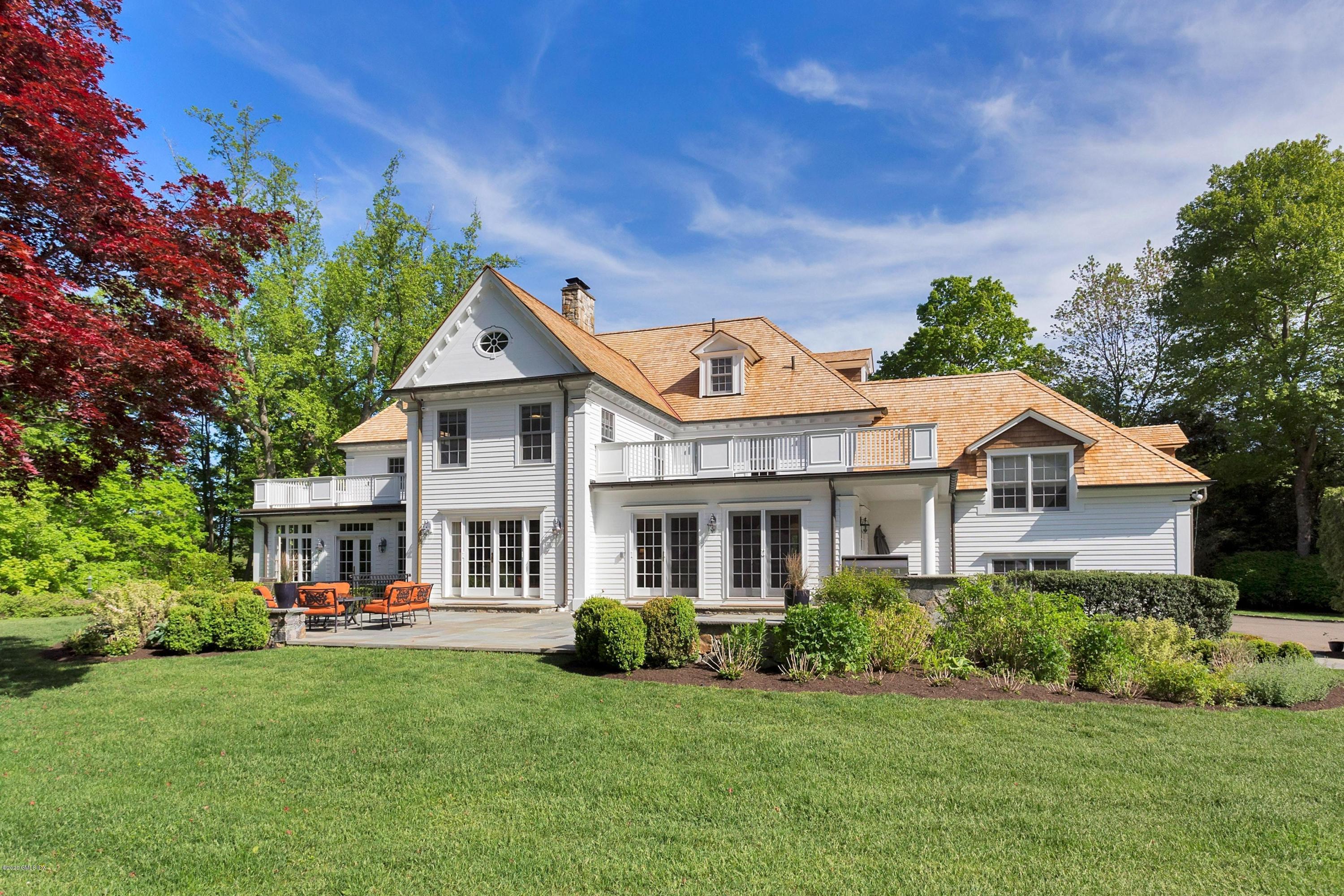 122 Butternut Hollow Road Greenwich, CT 06830 - Photo 31 of 36 a front view of a house with a garden