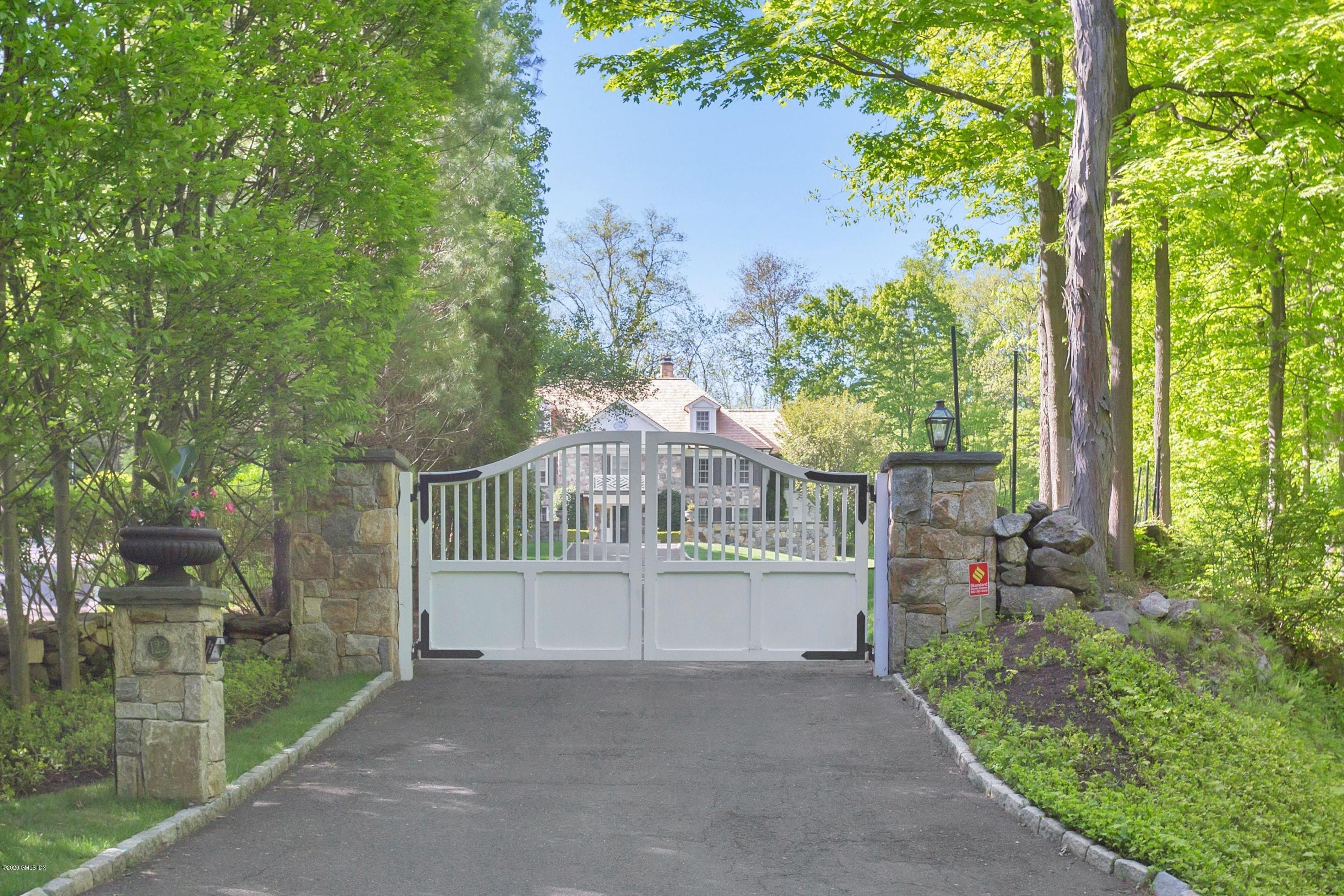 122 Butternut Hollow Road Greenwich, CT 06830 - Photo 32 of 36 a view of a house with a yard and garden