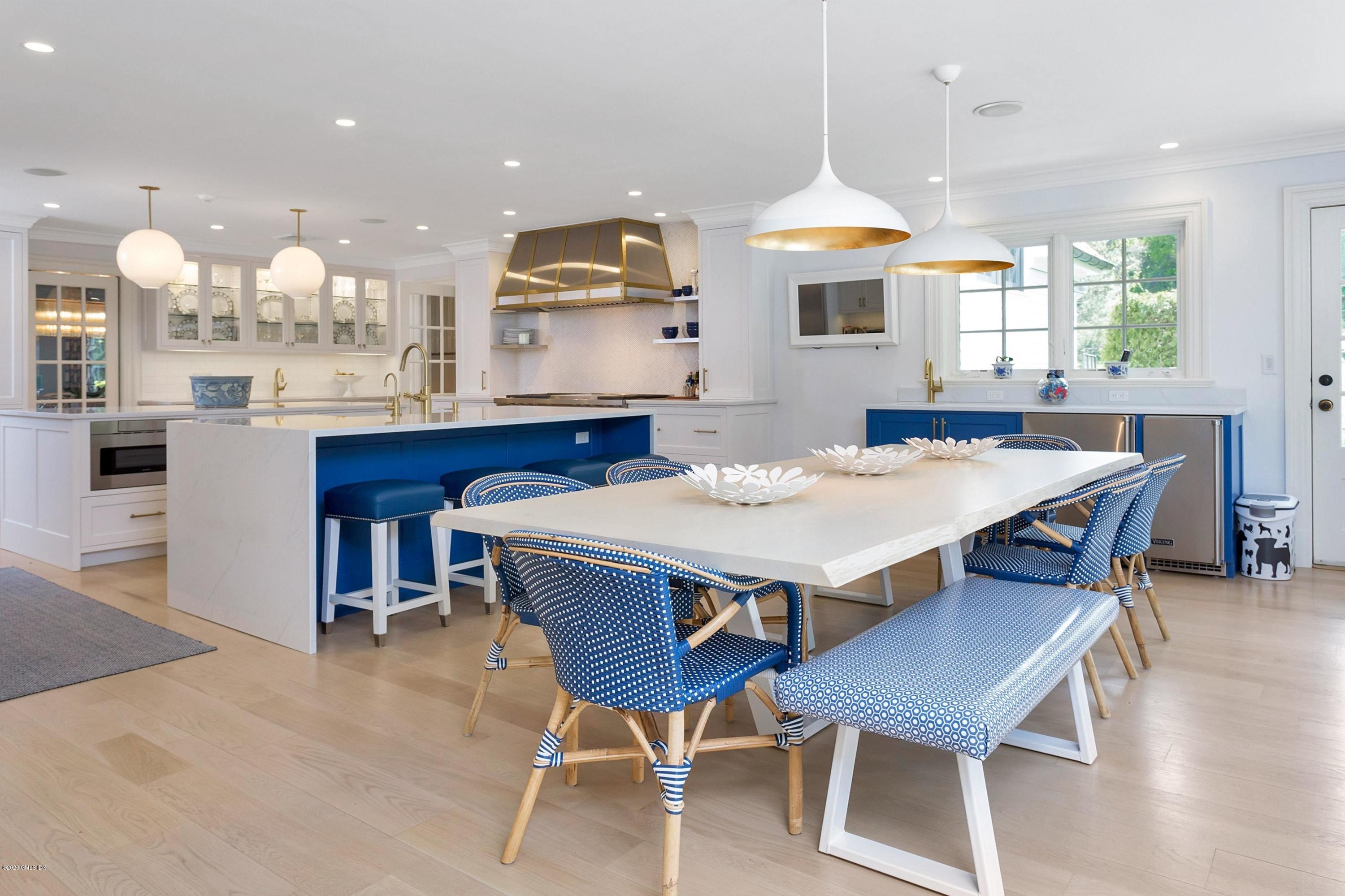 122 Butternut Hollow Road Greenwich, CT 06830 - Photo 6 of 36 a large kitchen with a table and chairs in it
