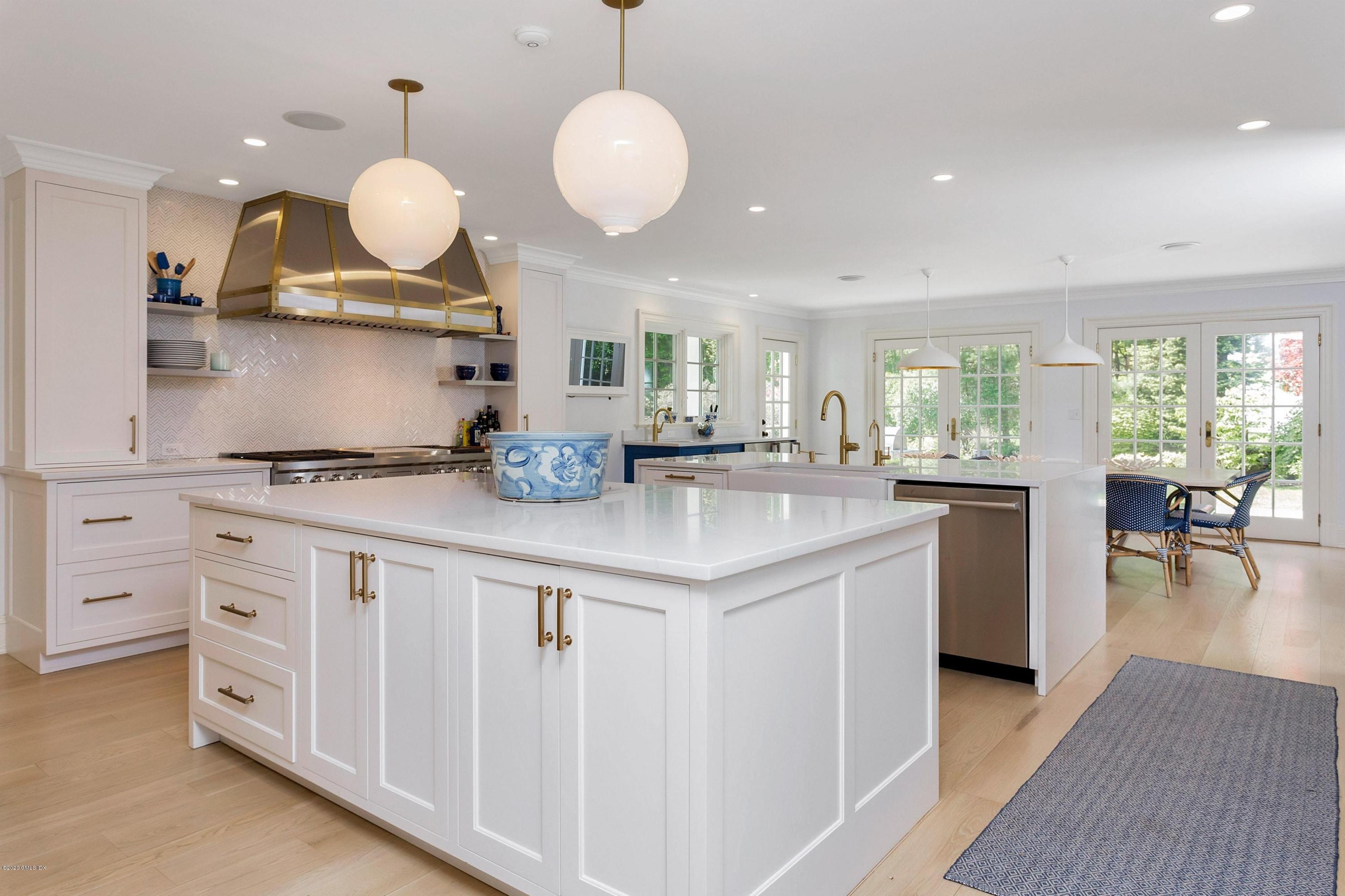 122 Butternut Hollow Road Greenwich, CT 06830 - Photo 7 of 36 a kitchen with granite countertop a white cabinets and chairs