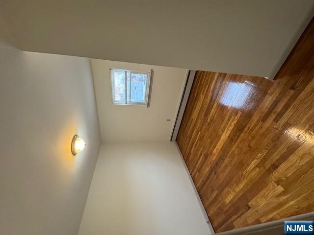 115 Gaston Avenue, Unit 2 Garfield, NJ 07026 - Photo 7 of 8 a view of empty room with wooden floor