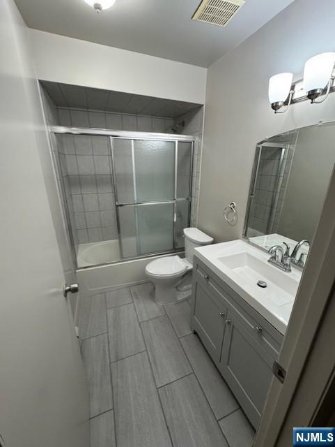 115 Gaston Avenue, Unit 2 Garfield, NJ 07026 - Photo 8 of 8 a bathroom with a sink a toilet and shower