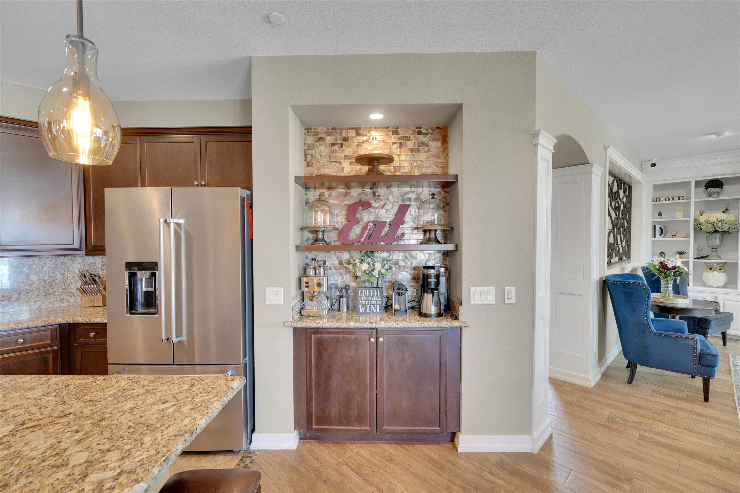 1635 Whitlatch Drive Lancaster, CA 93535 - Photo 14 of 58 a kitchen with stainless steel appliances granite countertop a refrigerator and a stove top oven