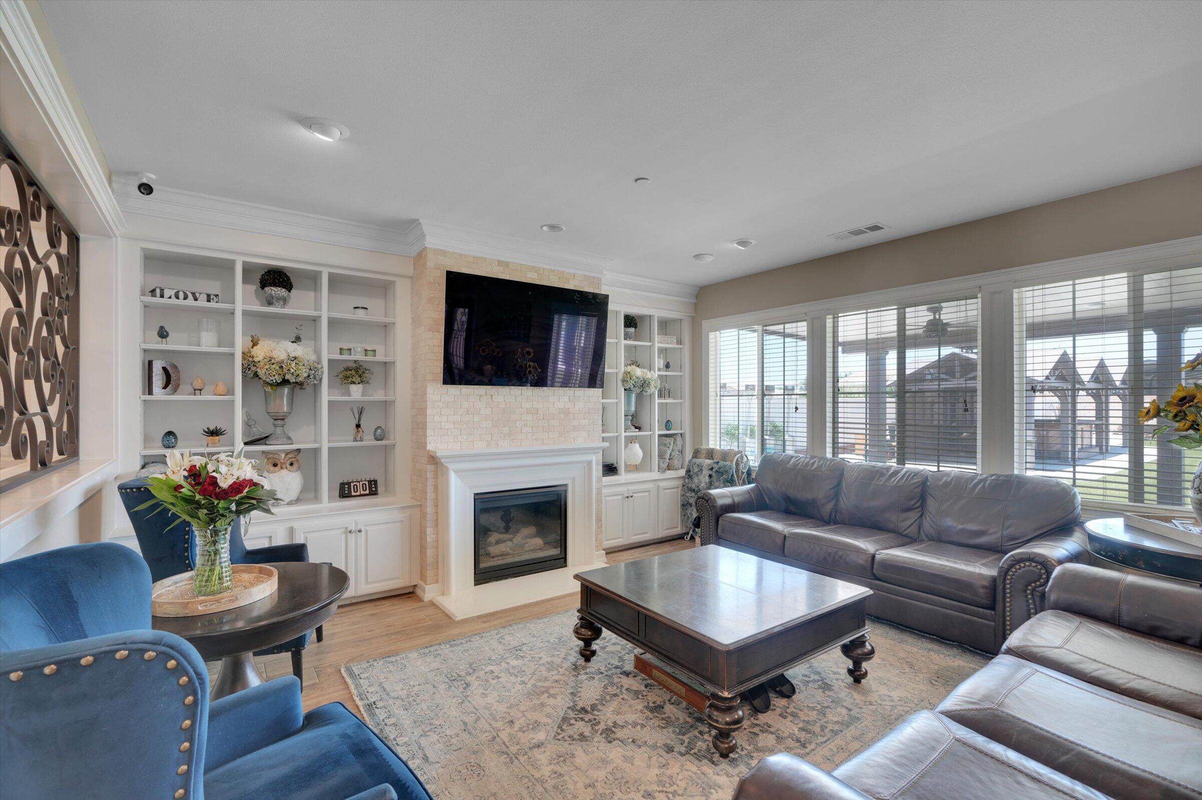1635 Whitlatch Drive Lancaster, CA 93535 - Photo 25 of 58 a living room with furniture fireplace and flat screen tv