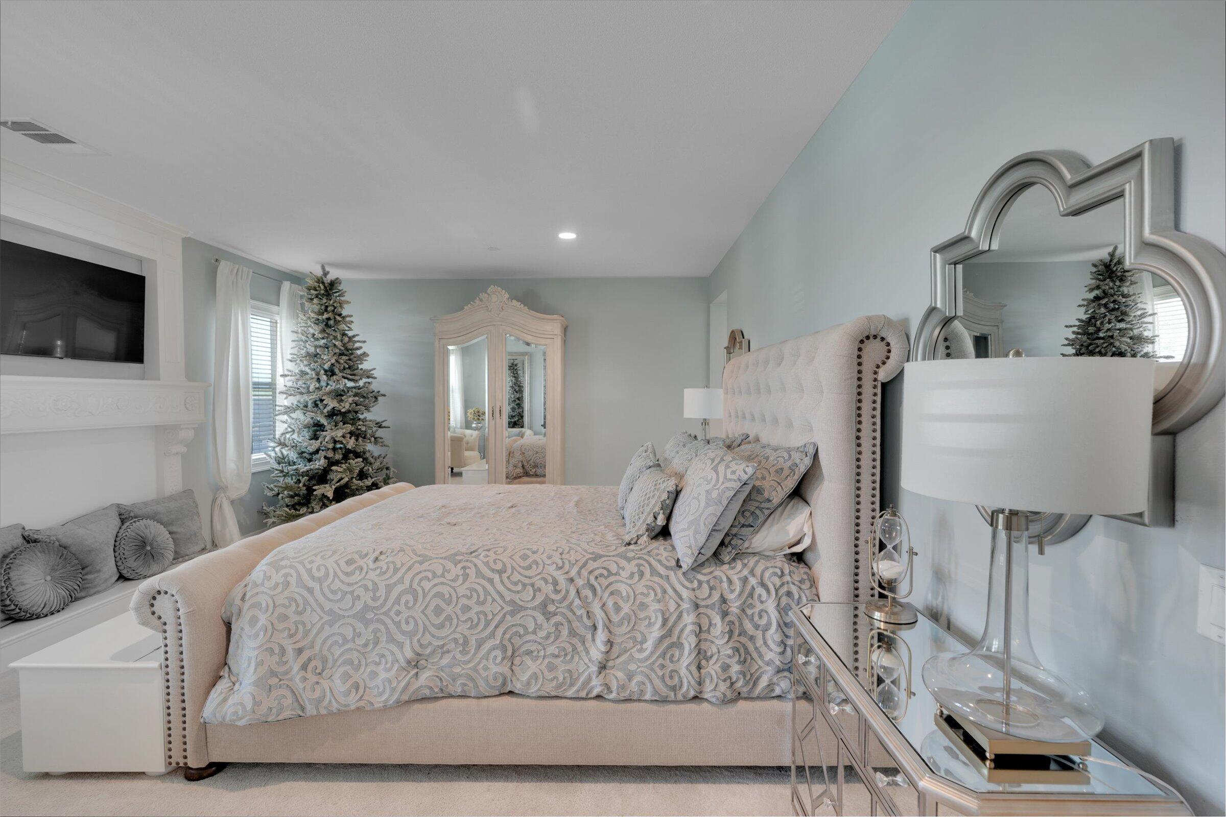 1635 Whitlatch Drive Lancaster, CA 93535 - Photo 29 of 58 a bedroom with a bed and a flat screen tv