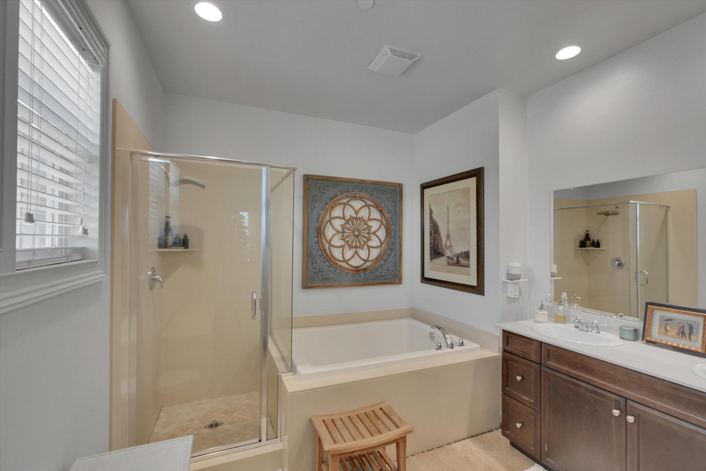 1635 Whitlatch Drive Lancaster, CA 93535 - Photo 33 of 58 a bathroom with a tub a sink and a large mirror