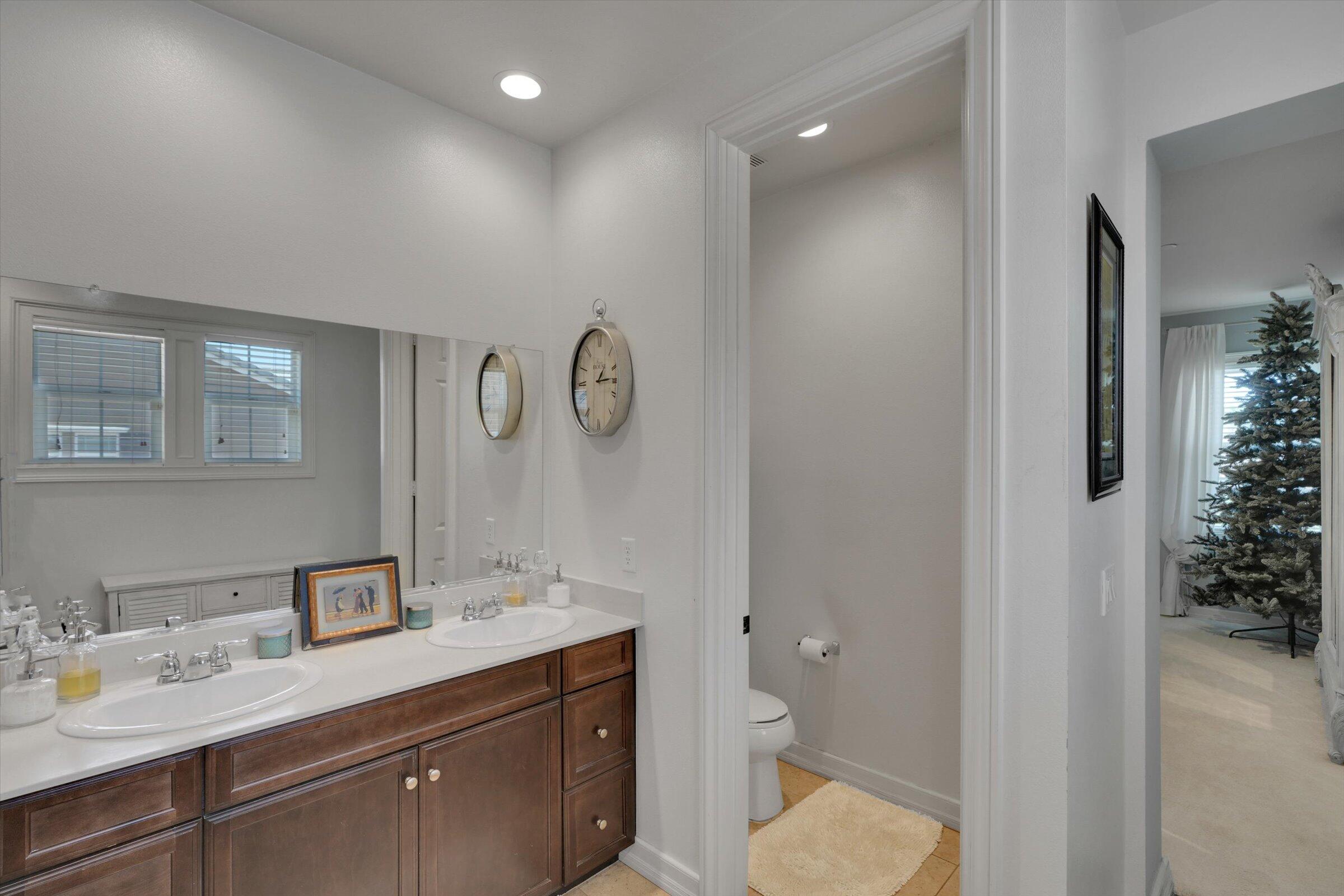 1635 Whitlatch Drive Lancaster, CA 93535 - Photo 34 of 58 a spacious bathroom with a granite countertop sink and a mirror