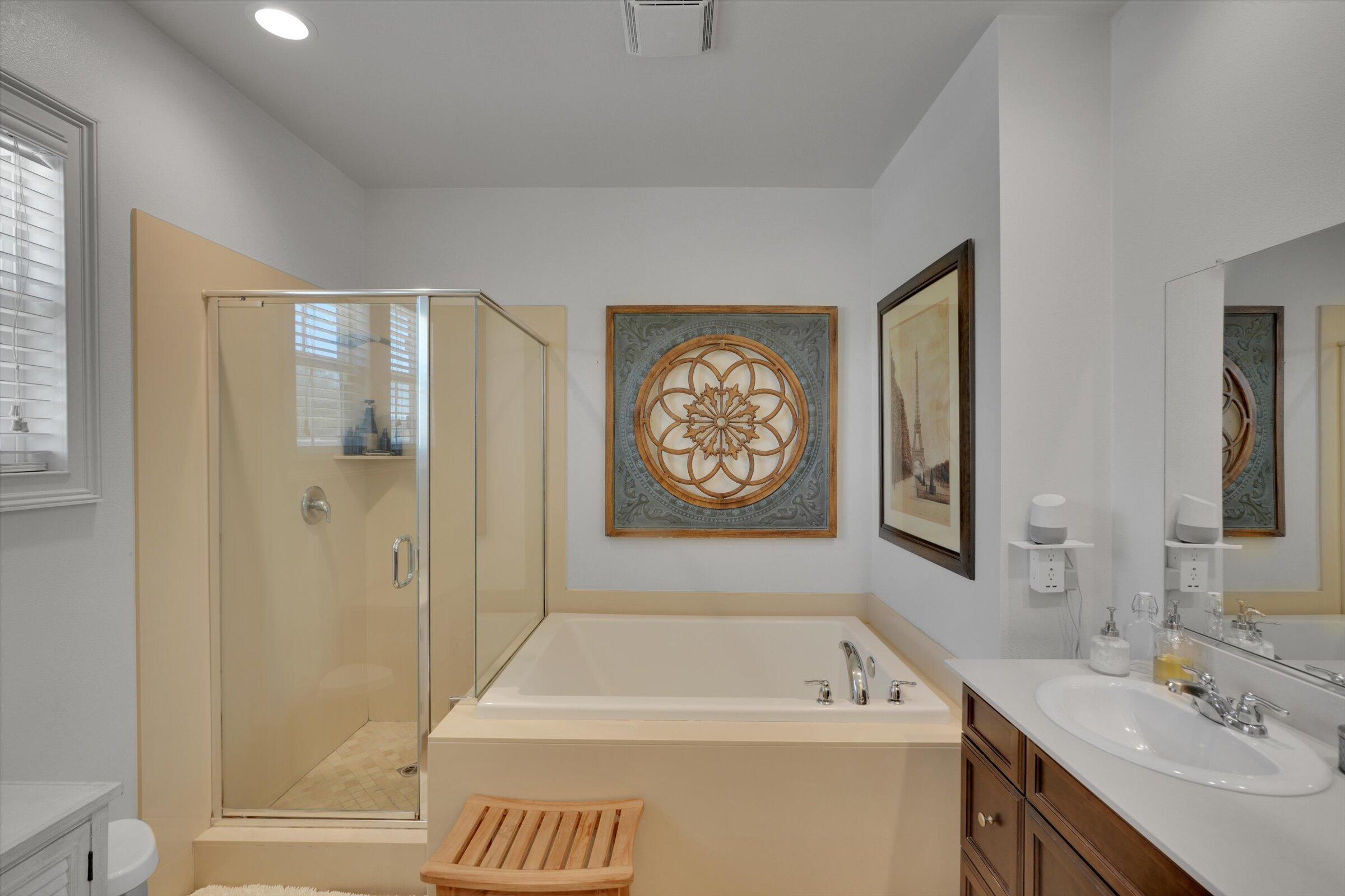 1635 Whitlatch Drive Lancaster, CA 93535 - Photo 35 of 58 a bathroom with a bathtub a shower a sink and mirror