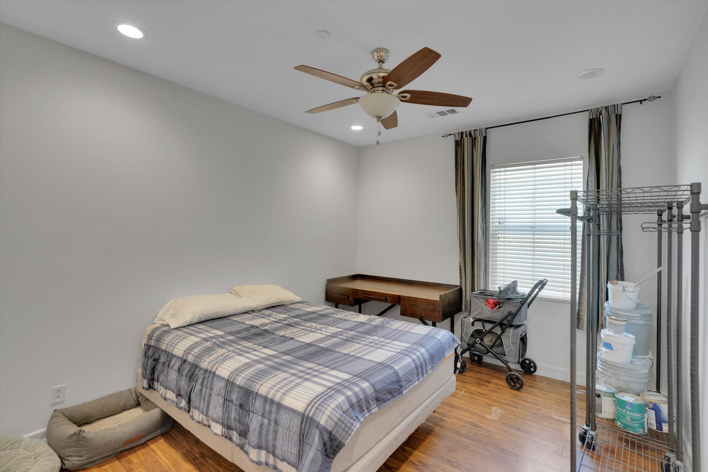 1635 Whitlatch Drive Lancaster, CA 93535 - Photo 38 of 58 a bedroom with a bed and a chandelier