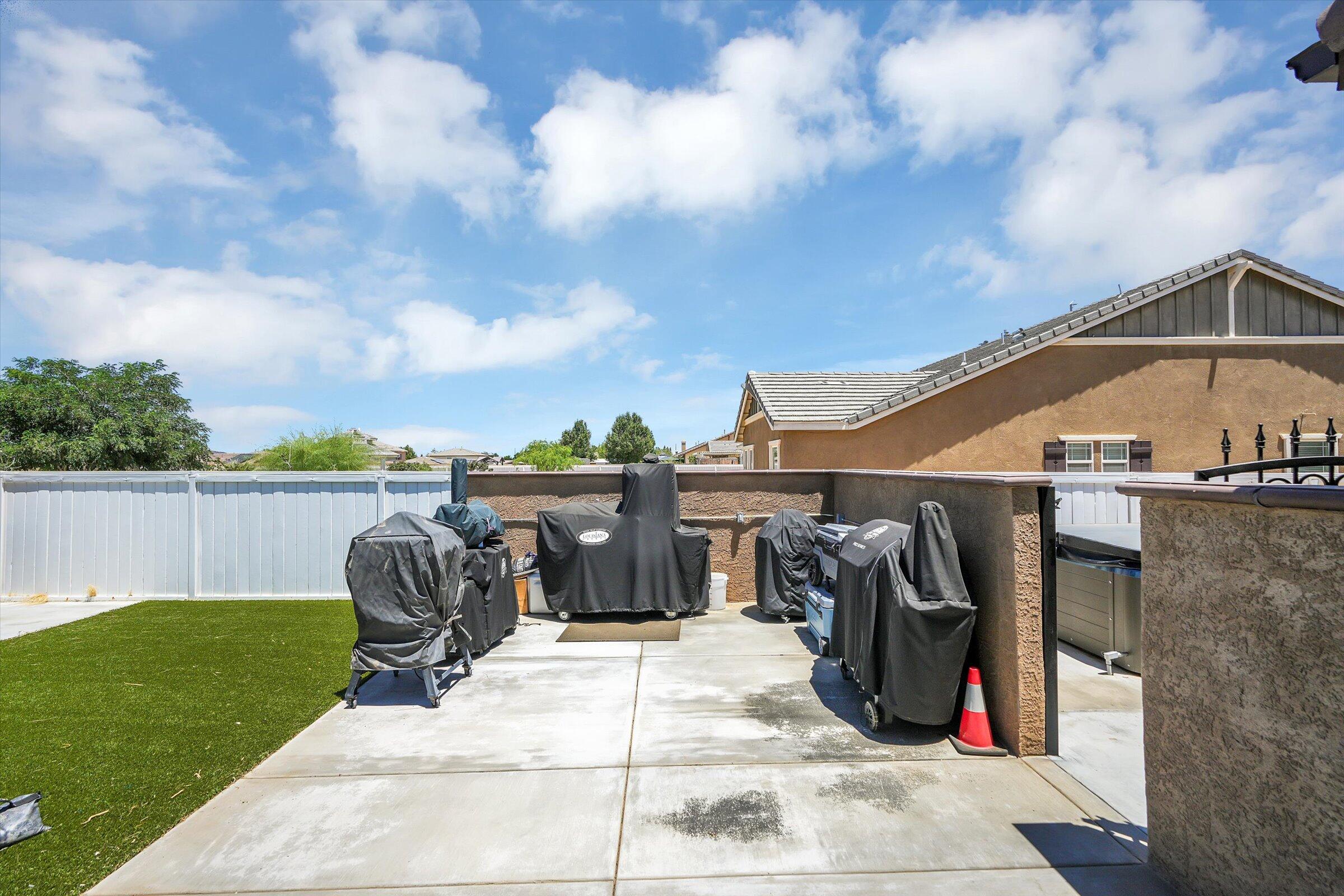 1635 Whitlatch Drive Lancaster, CA 93535 - Photo 40 of 58 a view of roof deck with chair and table
