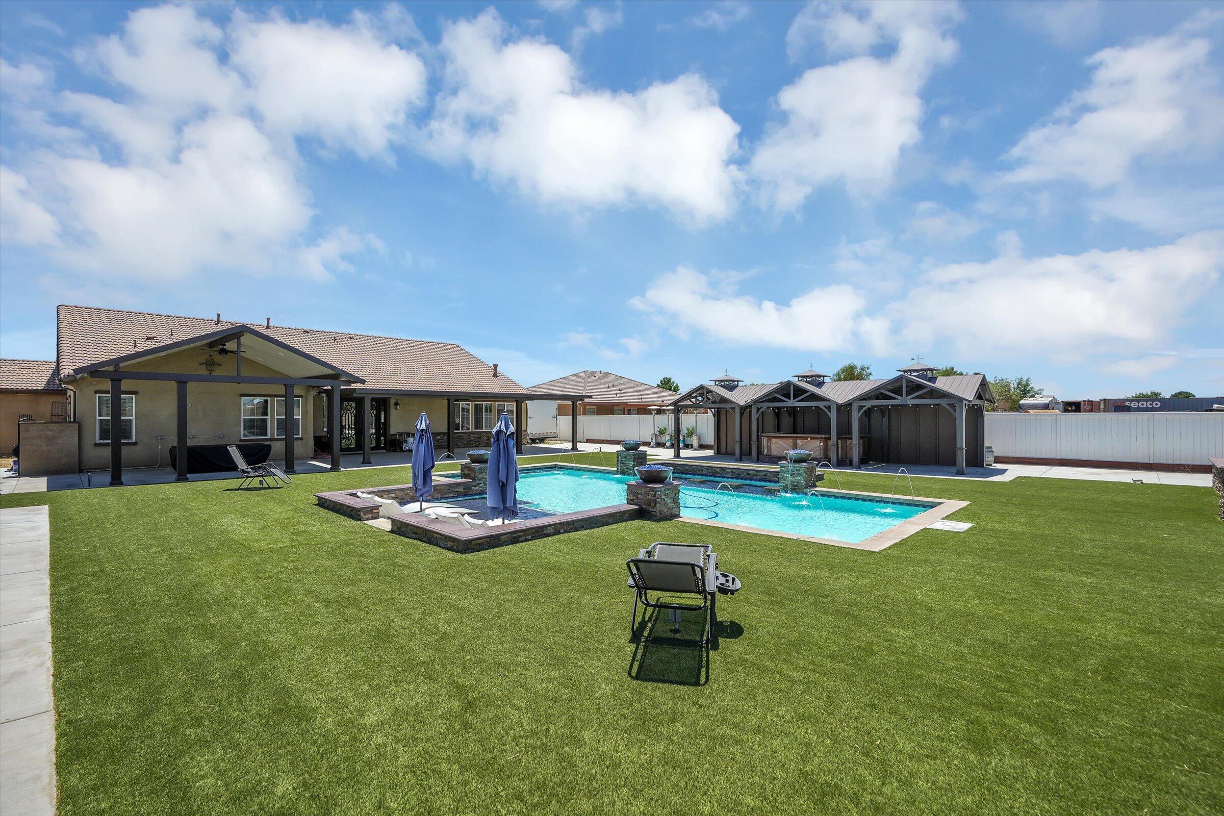 1635 Whitlatch Drive Lancaster, CA 93535 - Photo 46 of 58 a view of a house with swimming pool and porch
