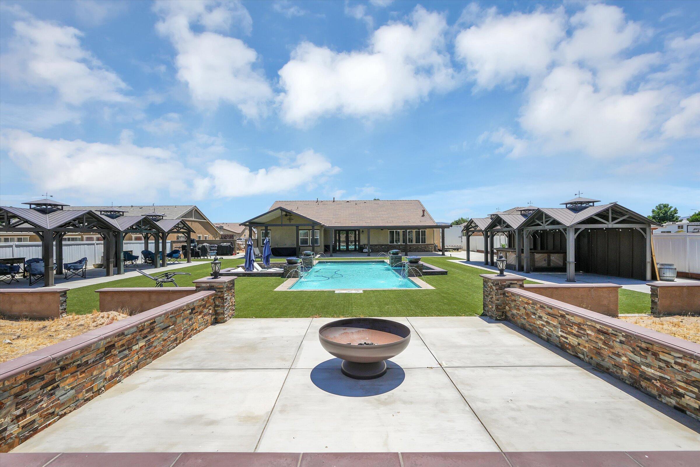 1635 Whitlatch Drive Lancaster, CA 93535 - Photo 47 of 58 a view of a house with swimming pool and sitting area