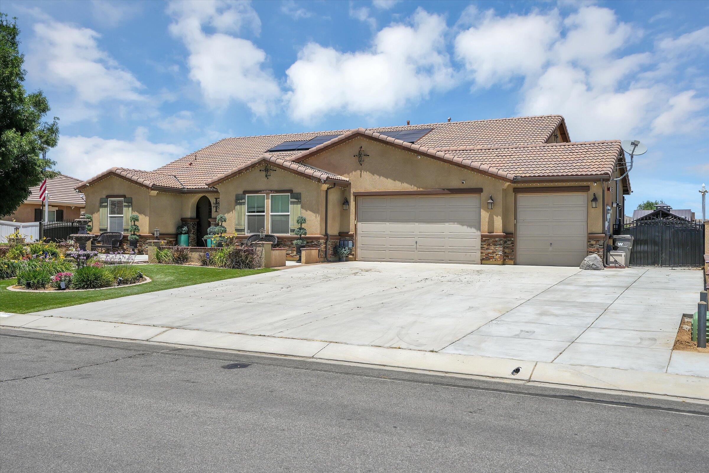 1635 Whitlatch Drive Lancaster, CA 93535 - Photo 6 of 58 a front view of a house with a yard