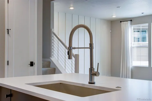 a view of a kitchen with a sink and a window