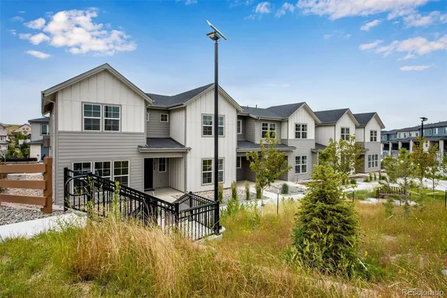 a swimming pool view with a outdoor seating