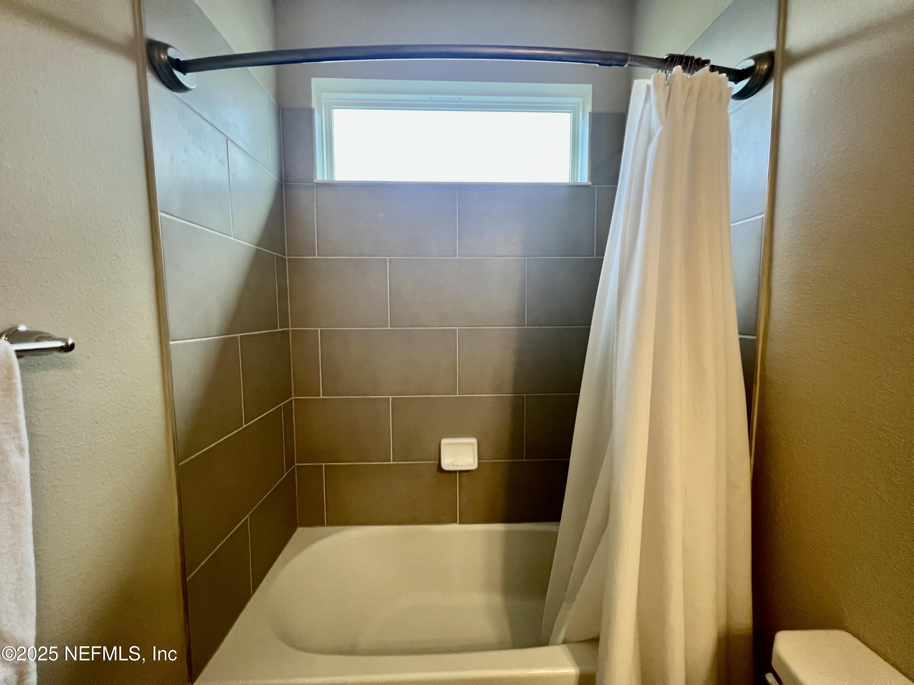 128 Ash Breeze Cove St. Augustine, FL 32095 - Photo 28 of 57 a bathroom with a shower and a toilet