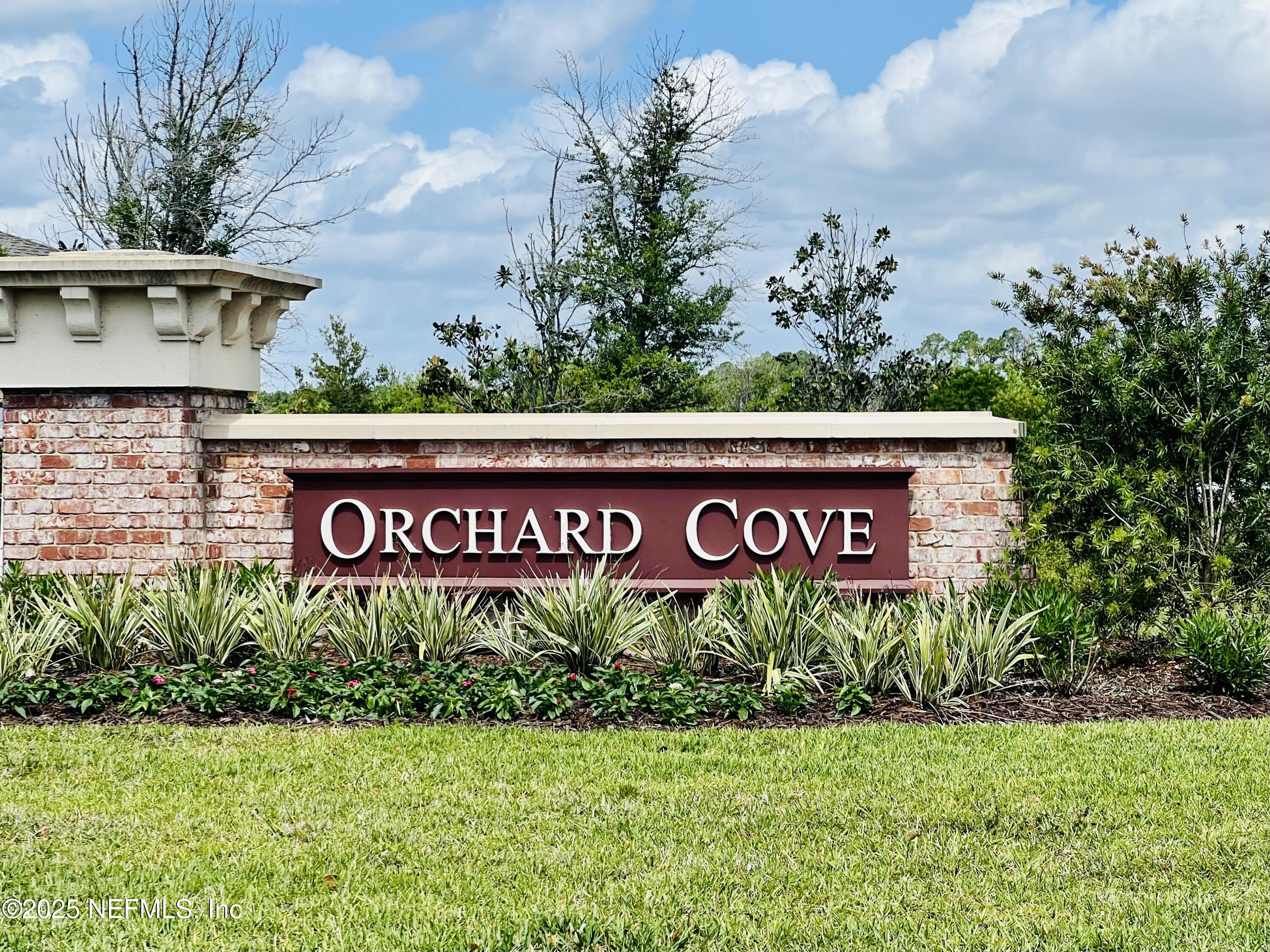 128 Ash Breeze Cove St. Augustine, FL 32095 - Photo 3 of 57 a sign that is sitting on a brick wall