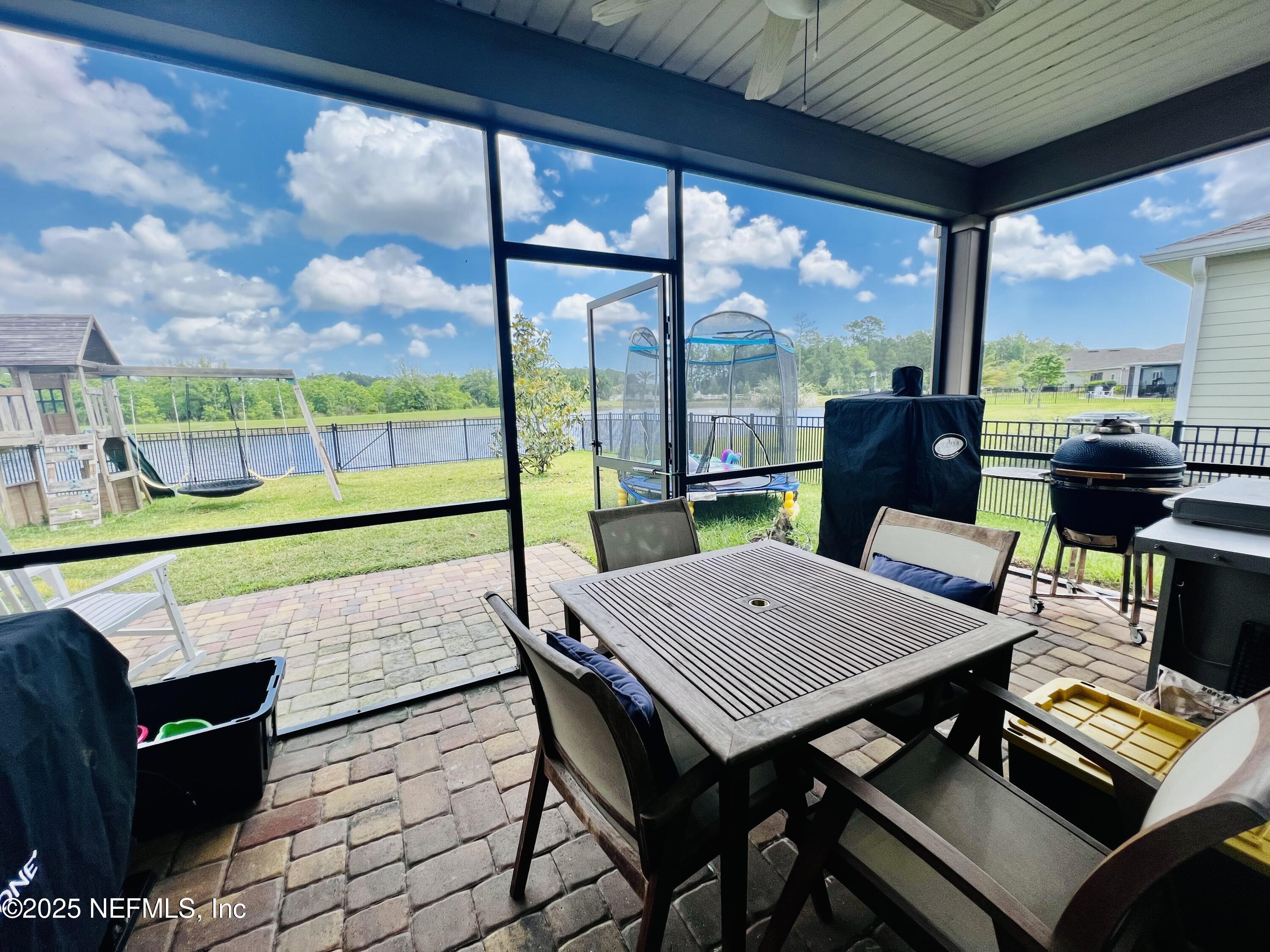 128 Ash Breeze Cove St. Augustine, FL 32095 - Photo 37 of 57 a view of a patio with table and chairs