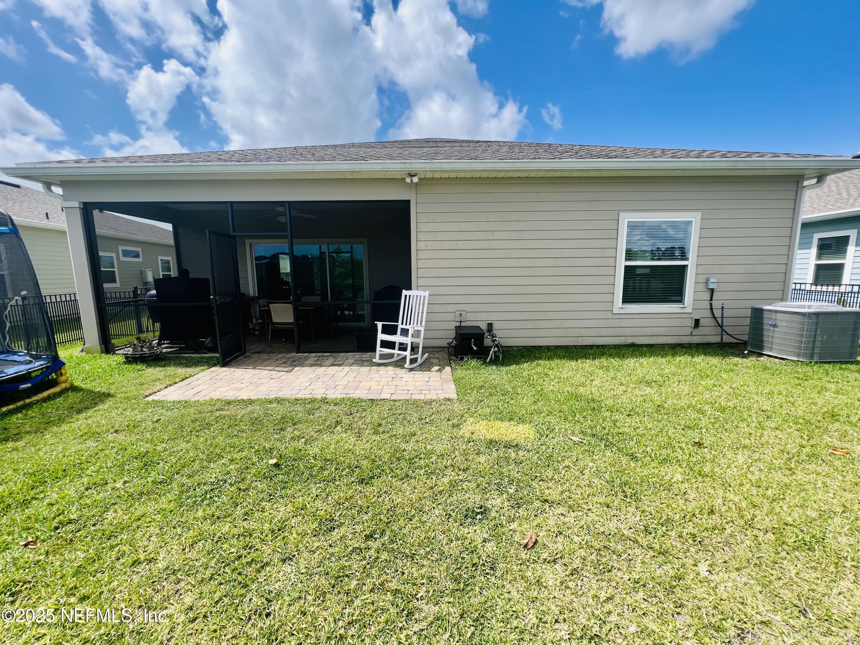 128 Ash Breeze Cove St. Augustine, FL 32095 - Photo 38 of 57 a view of a house with backyard porch and garden