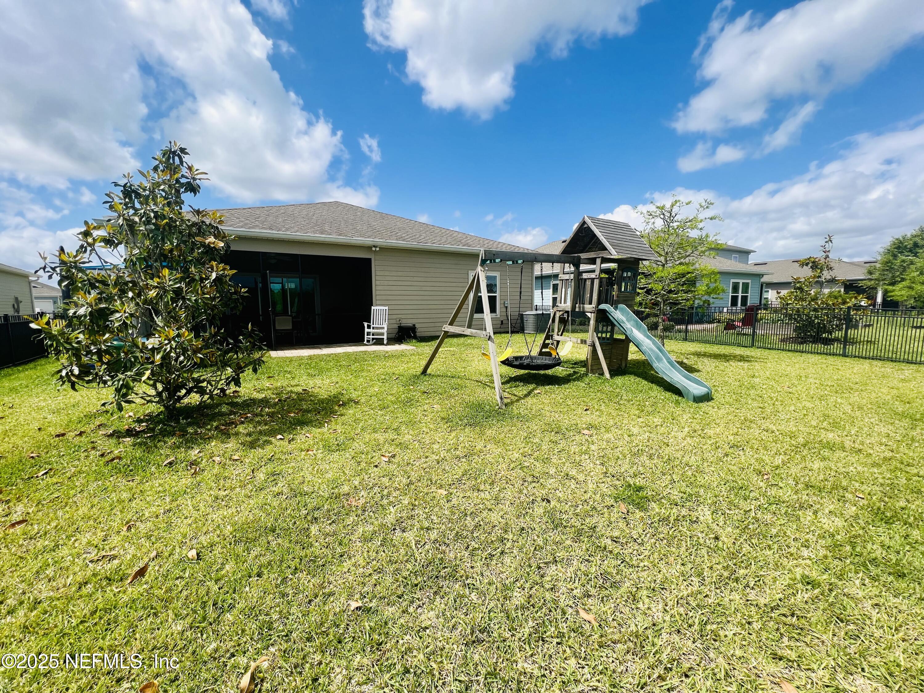128 Ash Breeze Cove St. Augustine, FL 32095 - Photo 41 of 57 a view of a house with a park