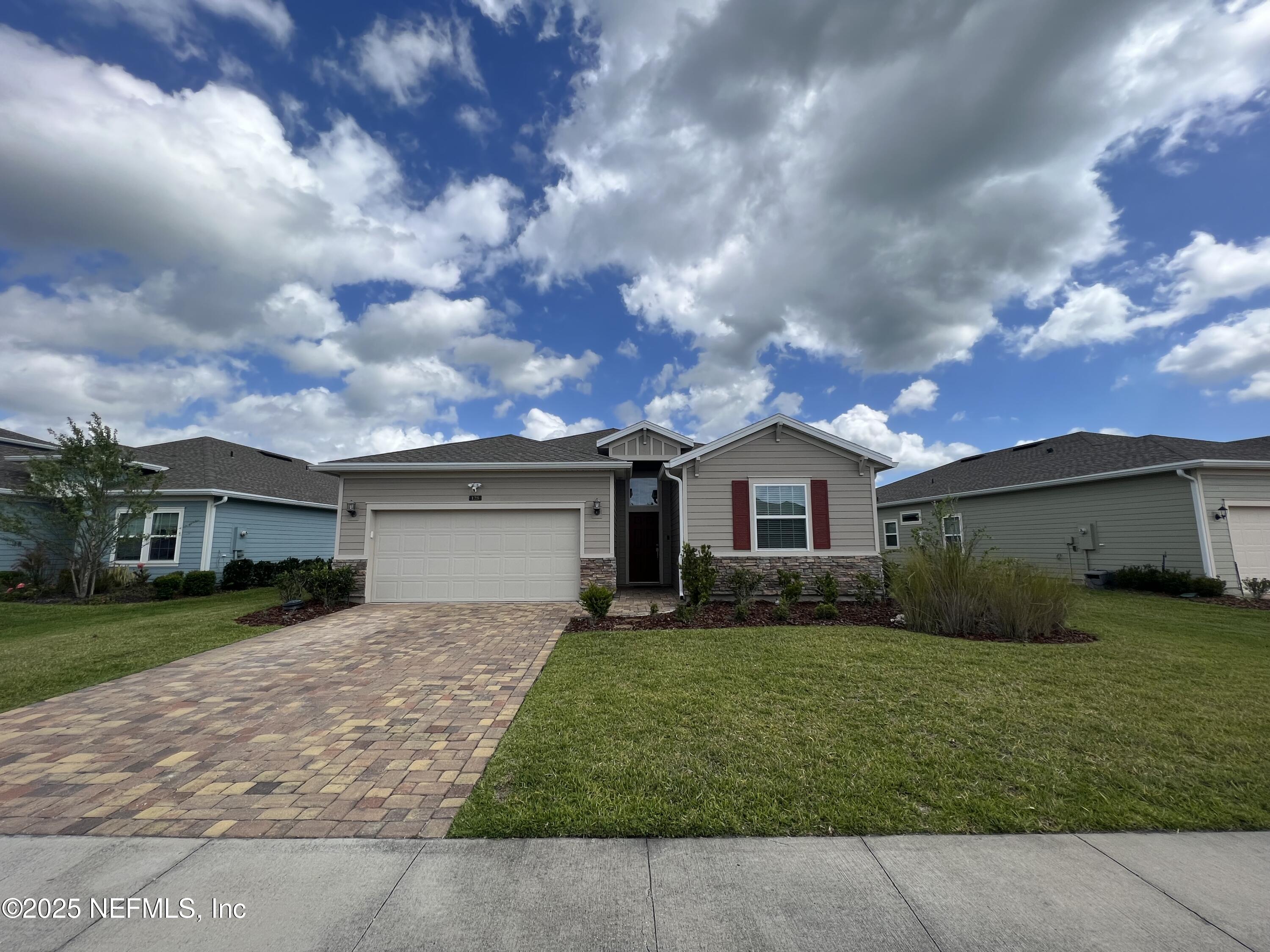 128 Ash Breeze Cove St. Augustine, FL 32095 - Photo 5 of 57 a front view of house with yard and green space