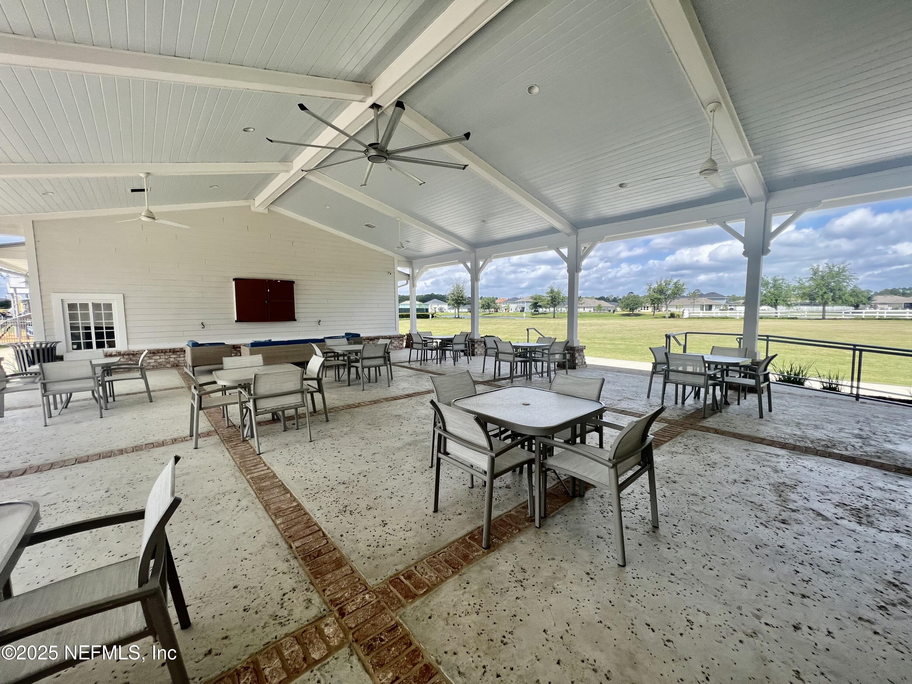 128 Ash Breeze Cove St. Augustine, FL 32095 - Photo 51 of 57 a dining room with furniture and wooden floor