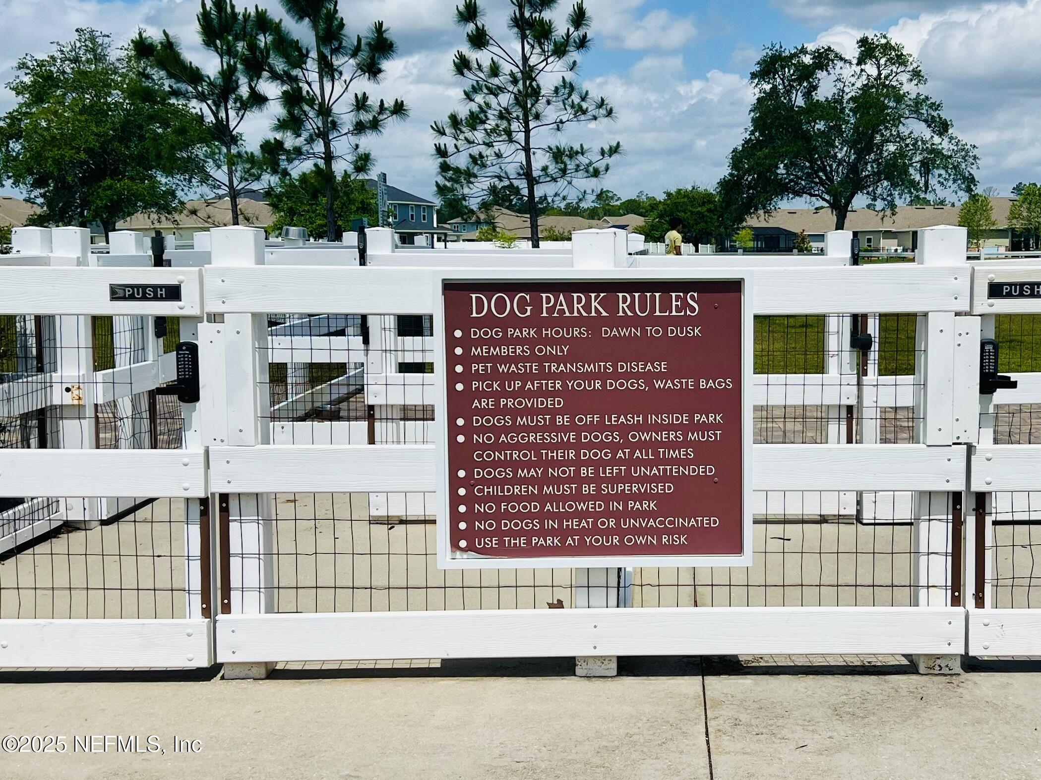 128 Ash Breeze Cove St. Augustine, FL 32095 - Photo 54 of 57 a sign on the side of a building