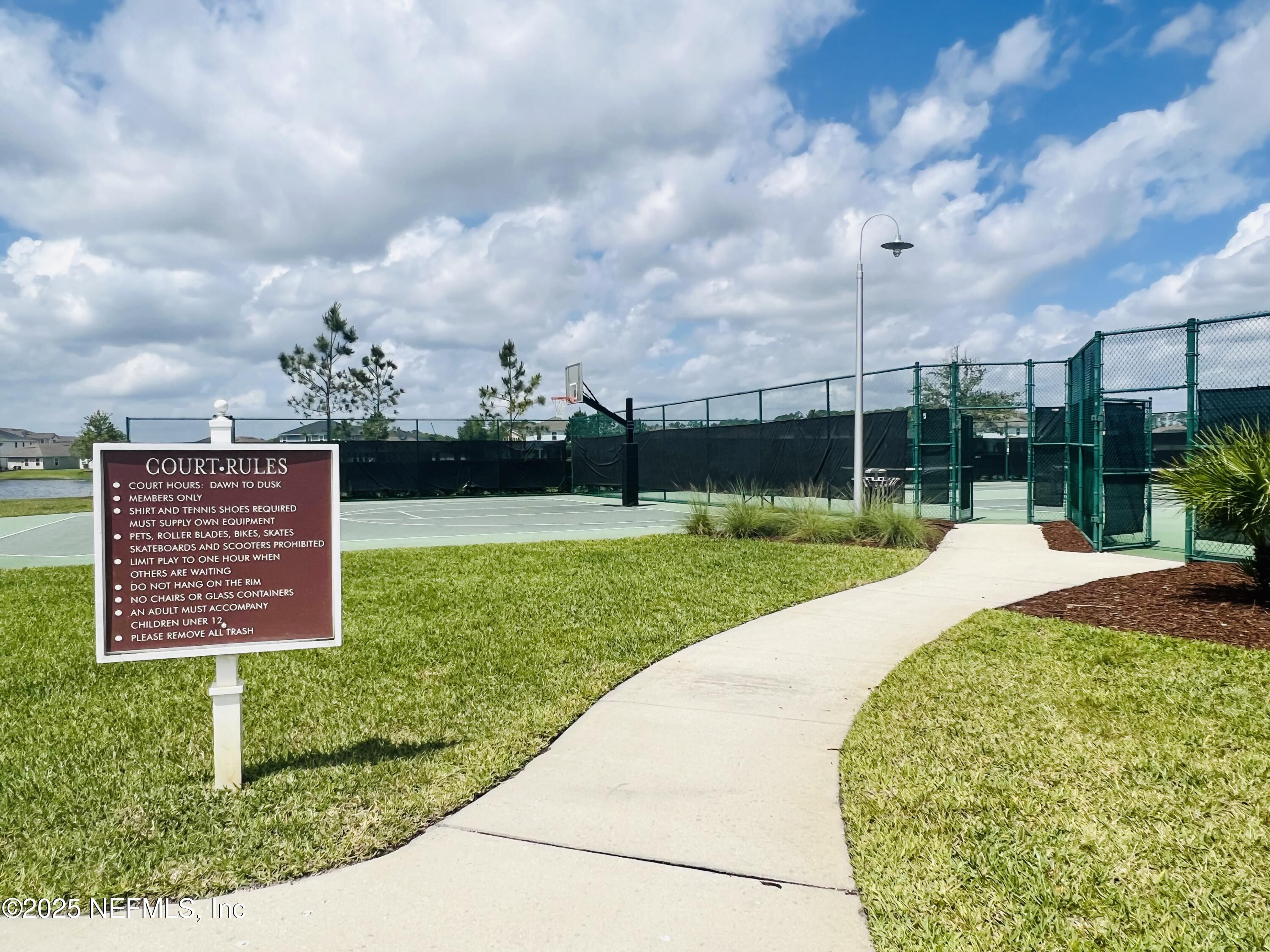 128 Ash Breeze Cove St. Augustine, FL 32095 - Photo 55 of 57 a view of a garden with a pathway