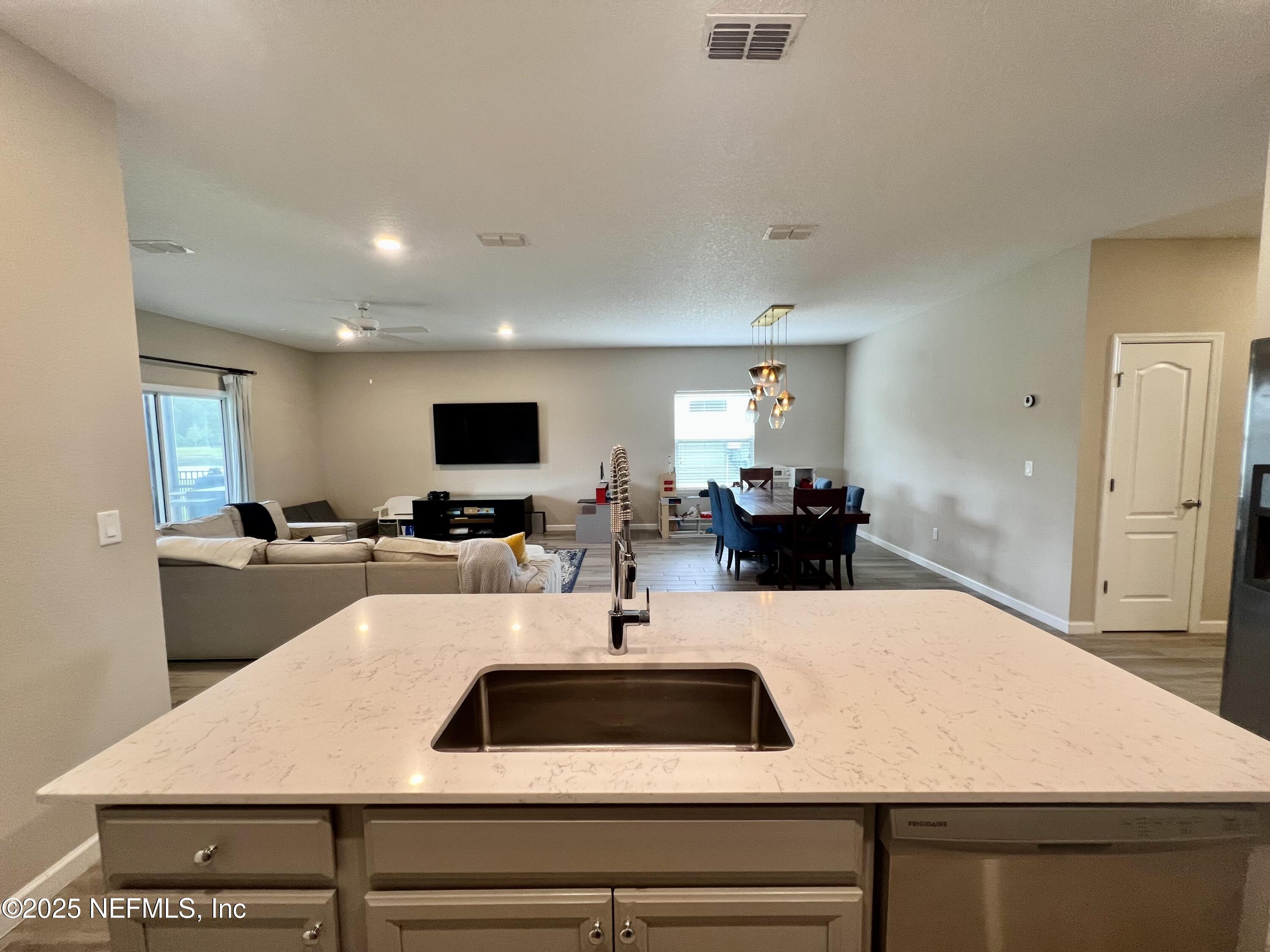 128 Ash Breeze Cove St. Augustine, FL 32095 - Photo 10 of 57 a kitchen with a table and chairs