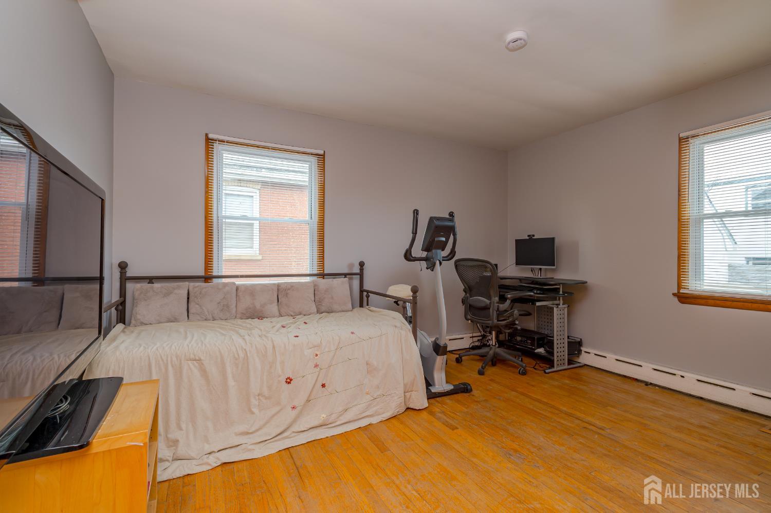 10 Mary Avenue Fords, NJ 08863 - Photo 13 of 23 a bedroom with a bed and a table in it